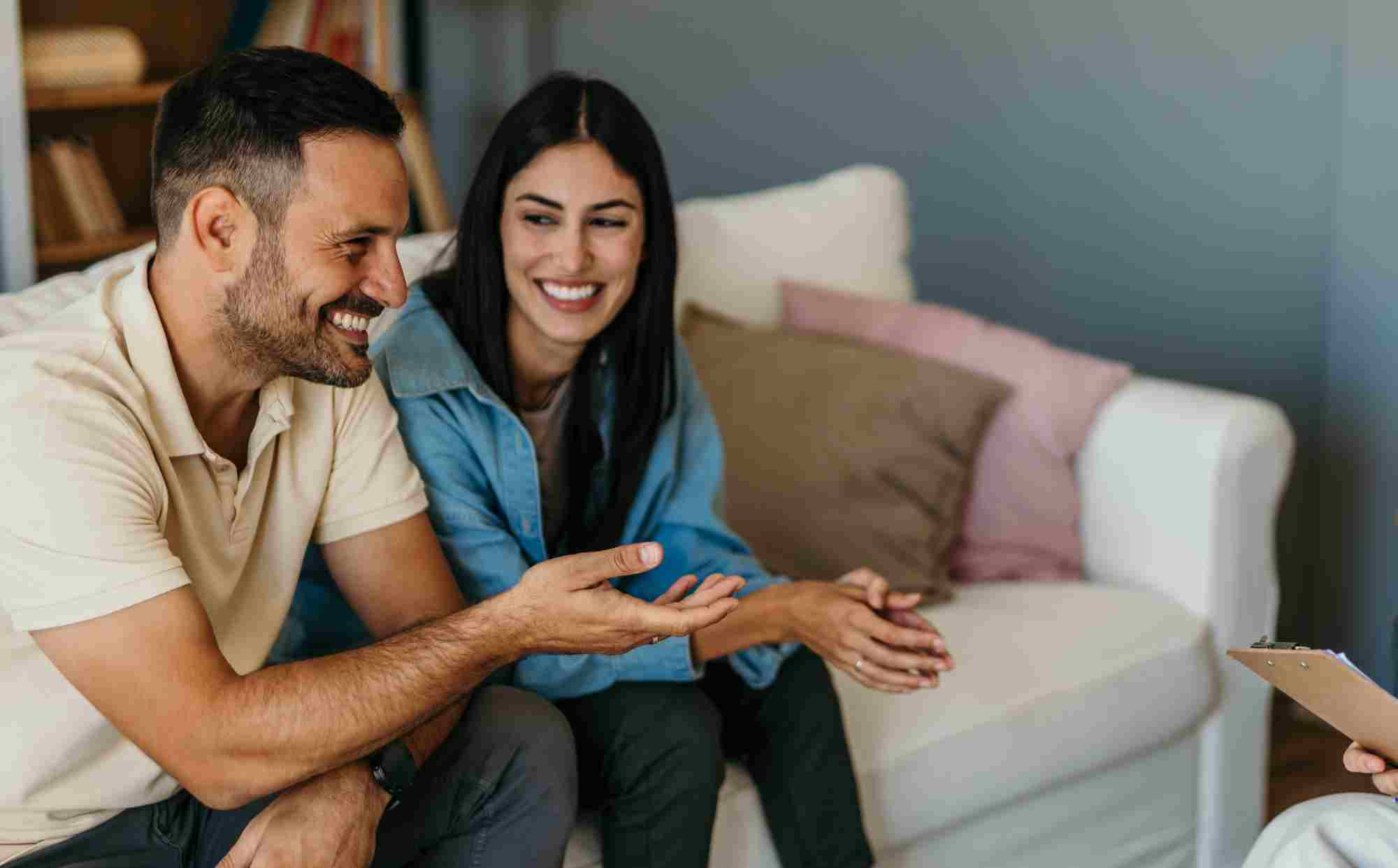 Young couple talking to therapist in mediation